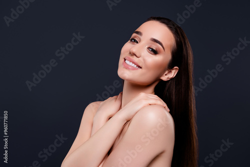 Stunning lovely cheerful lady fashion model new beauty product isolated on dark grey color background