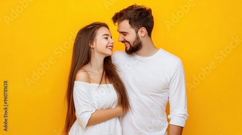 A man and a woman are smiling at the camera