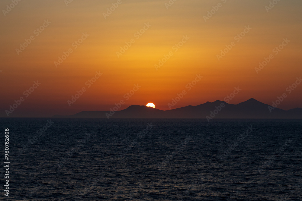 Greek sunsets over the Aegean sea during summer Greek sunsets over the Aegean sea during summer