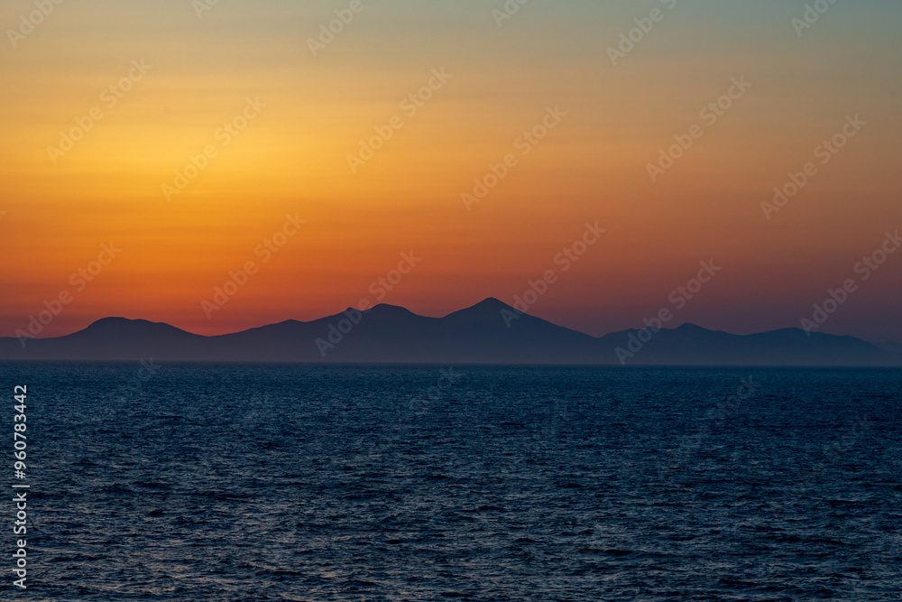 Greek sunsets over the Aegean sea during summer Greek sunsets over the Aegean sea during summer