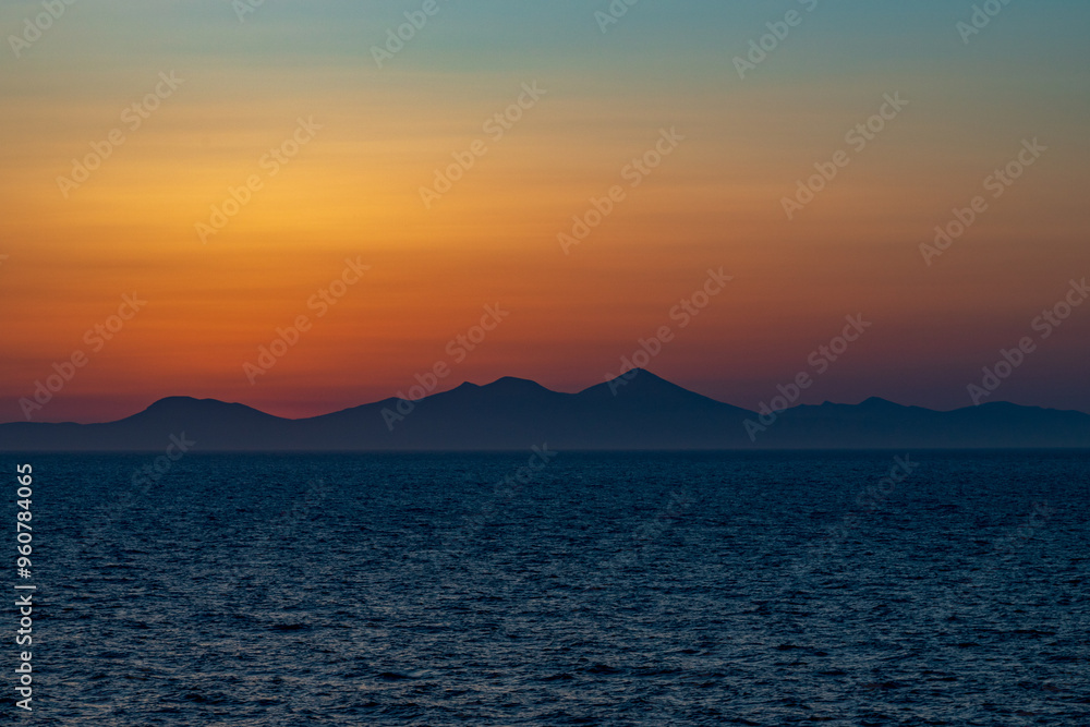 Greek sunsets over the Aegean sea during summer Greek sunsets over the Aegean sea during summer