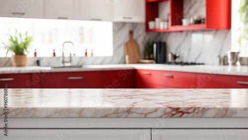The empty white marble table top with blur background of red kitchen. For product display