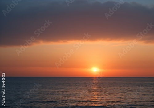 Sunset Over Calm Ocean Waves