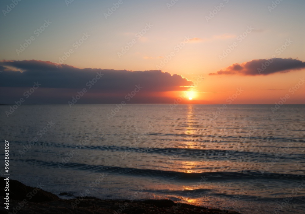Fototapeta premium Sunset Over Calm Ocean Waves