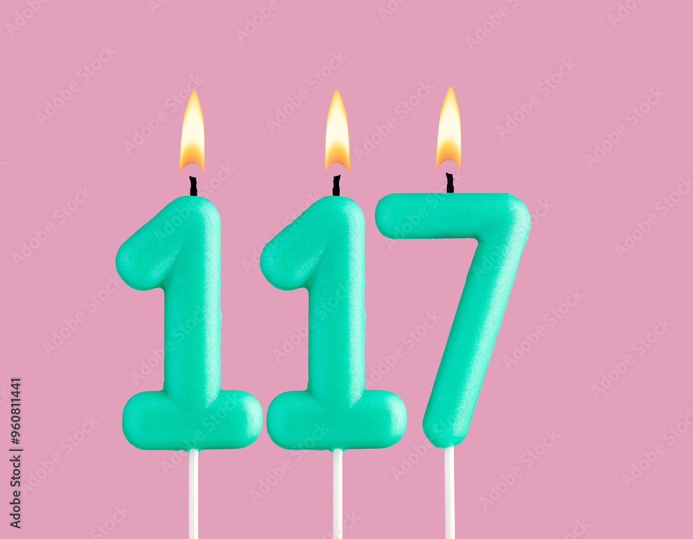 Green candle number 117 - Birthday card on pastel pink background Green candle number 117 - Birthday card on pastel pink background