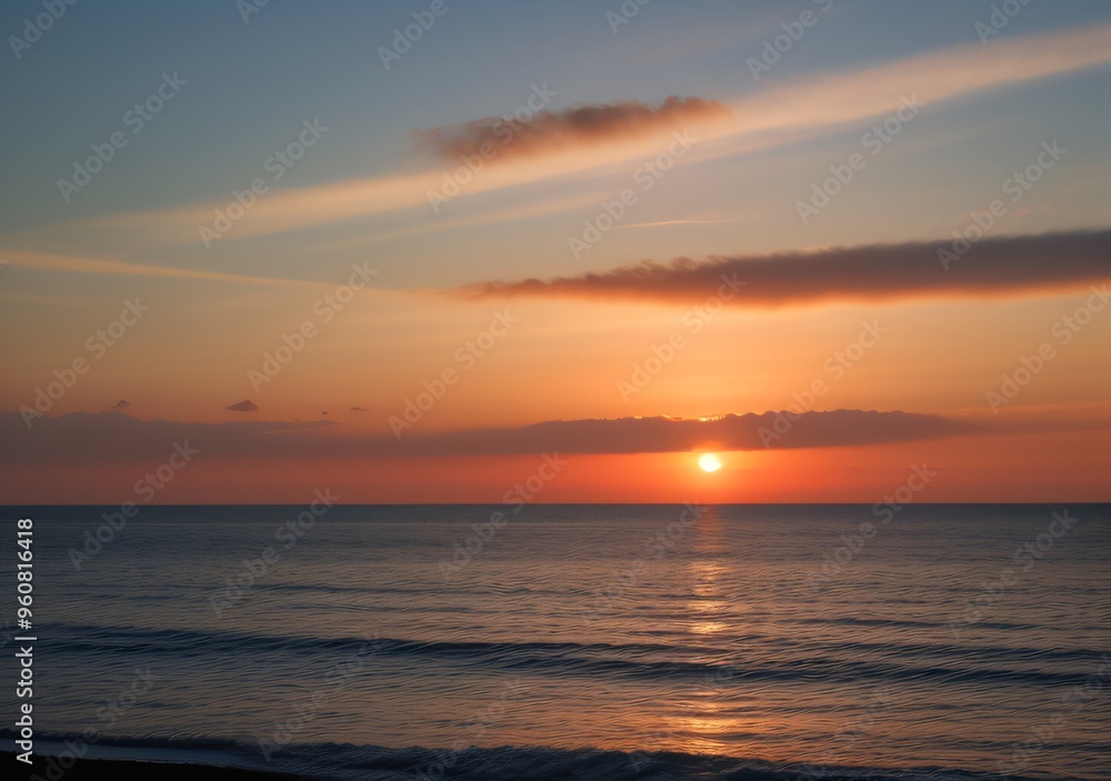 Fototapeta premium Sunset Over Calm Ocean Waves