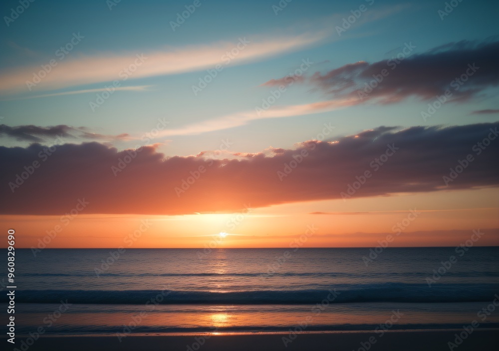 Fototapeta premium Sunset Over Calm Ocean Waves