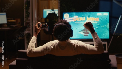 Εκτύπωση καμβά BIPOC man happy after winning SF game, destroying all enemy spacecrafts and finishing level
