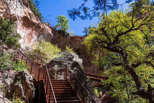 Looking up at the falls from the bottom of the observation decking at Tonto Natural Bridge State Park near Payson, Arizona. photo