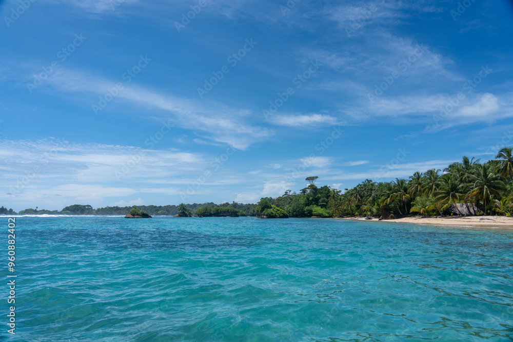 Clear Blue Water and Scenic Tropical Beach Surrounded by Palm Trees and Lush Nature - A Serene Island Paradise Offering Eco-Tourism and Adventure Travel in a Remote, Unspoiled Caribbean Destination Clear Blue Water and Scenic Tropical Beach Surrounded by Palm Trees and Lush Nature - A Serene Island Paradise Offering Eco-Tourism and Adventure Travel in a Remote, Unspoiled Caribbean Destination