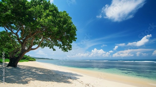 Tropical Beach Paradise with Clear Blue Water, White Sand, and Lush Green Trees on a Sunny Day