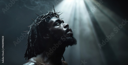 Cinematic shot of an African American man portraying Jesus, wearing a crown of thorns. photo