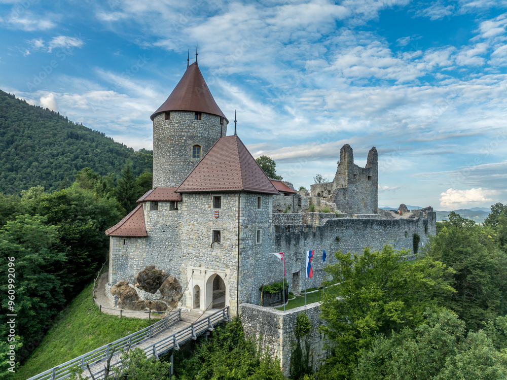 Aerial panoramic view of Zovnek castle, oldest medieval stronghold in Slovenia with partially restored great tower, castle gate, draw bridge Aerial panoramic view of Zovnek castle, oldest medieval stronghold in Slovenia with partially restored great tower, castle gate, draw bridge