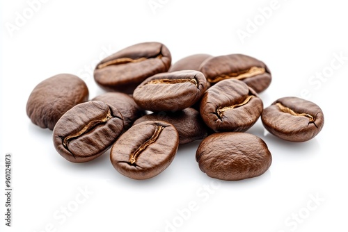 A collection of roasted coffee beans arranged on a white background.