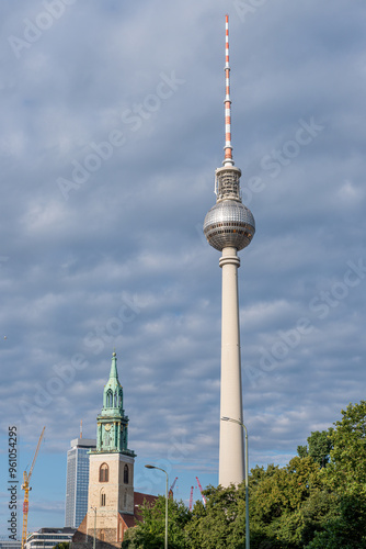 The famous TV Tower in Berlin with the tower of the Marienkirche at Alexanderplatz