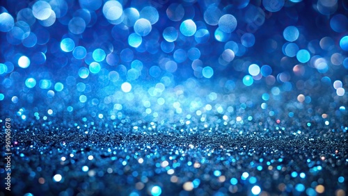 Abstract blue glitter background with defocused lights photo