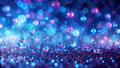 Abstract blue glow particles with small shining balls on purple pink bokeh background depth of field
