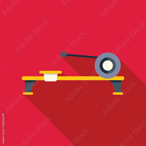 Yellow rowing machine standing on red background with shadow, side view