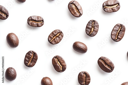 A flat lay of various coffee beans on a white background showcasing their texture and color.