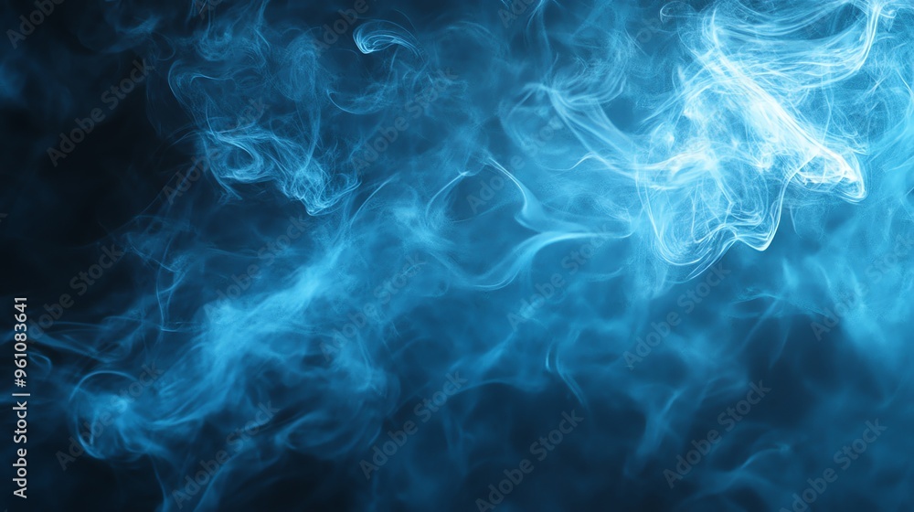 Obraz premium Abstract blue smoke flowing on black background.