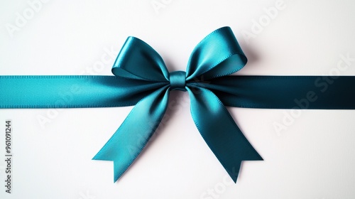 A beautiful teal satin ribbon bow tied elegantly on a white background, perfect for gifts and decorations.