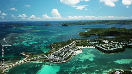 Wallpaper Mural Drone shot overlooking the shallow coast and vacation homes in sunny Antigua Torontodigital.ca
