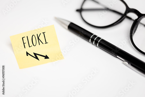 Obraz na plátně A yellow sticky note on a white background with a handwritten inscription FLOKI