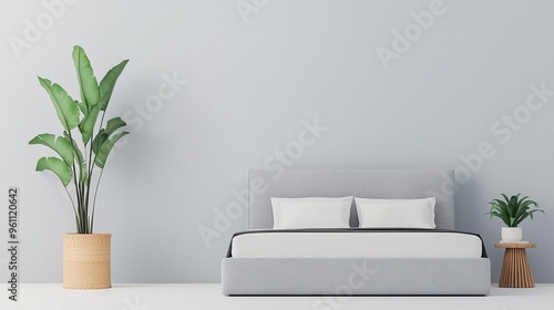 Minimalist bedroom interior with gray bed, white pillows, and plants. photo