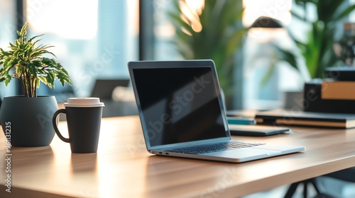 Wallpaper Mural A laptop computer and a cup of coffee on a wooden desk, a perfect setup for a productive workday. Torontodigital.ca