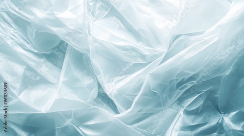Wallpaper Mural Abstract background of crumpled translucent plastic with soft blue tones, creating a smooth and wavy texture. Torontodigital.ca