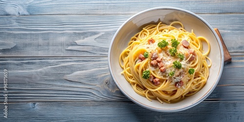 dinner, traditional, cheese, carbonara sauce, culinary, flavorful, gastronomy, A bird s eye view of a bowl on a napkin filled with delicious spaghetti carbonara topped with grated cheese photo