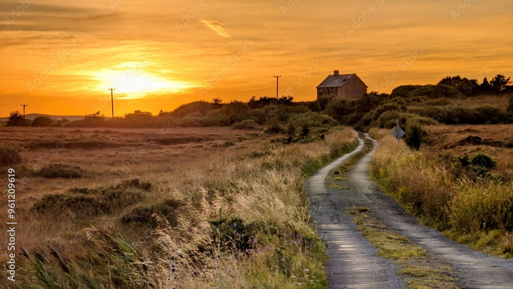 Beautiful sunset scenery with country house on the hillside at county Galway, Ireland, rural area, nature background