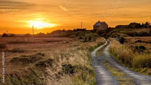 Obraz na płótnie Beautiful sunset scenery with country house on the hillside at county Galway, Ireland, rural area, nature background w salonie