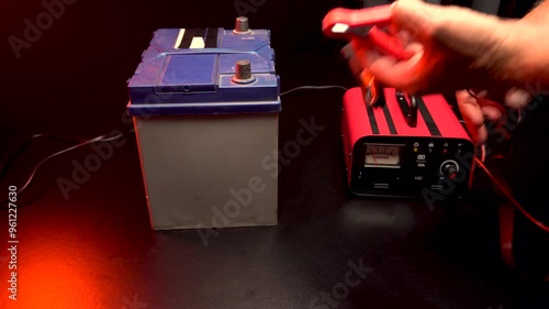 red new car battery charger with ammeter and terminals for 6 volts and 12 volts