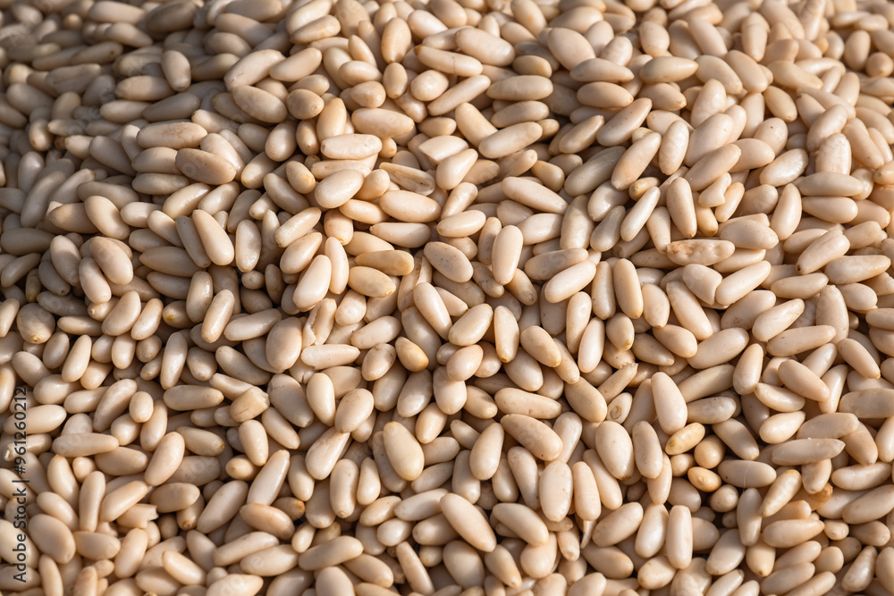 Peeled pine nuts heap. spice seller. Peeled pine nuts heap. spice seller.