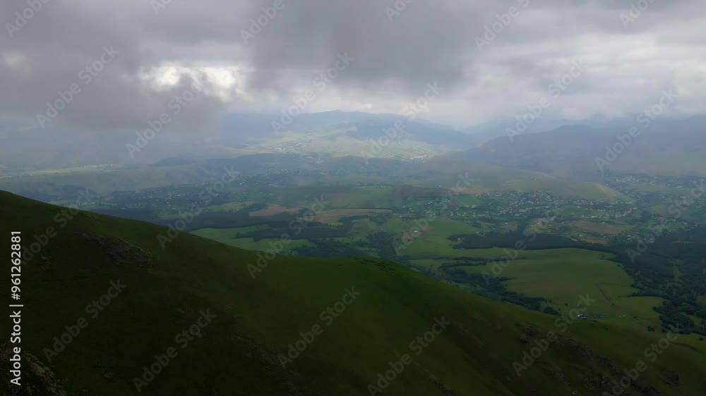 Drone shot flying towards a valley in the Gadabay district in the caucasus mountains in Azerbaijan. Drone shot flying towards a valley in the Gadabay district in the caucasus mountains in Azerbaijan.