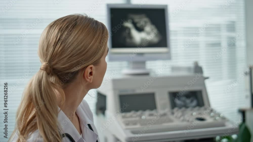 Closeup doctor looking ultrasound image on monitor. Healthcare worker checking Closeup doctor looking ultrasound image on monitor. Healthcare worker checking