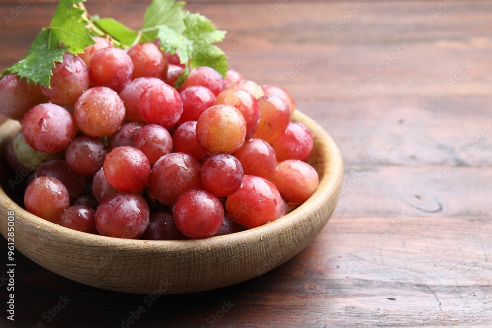 Fresh ripe grapes on wooden table, closeup. Space for text Fresh ripe grapes on wooden table, closeup. Space for text