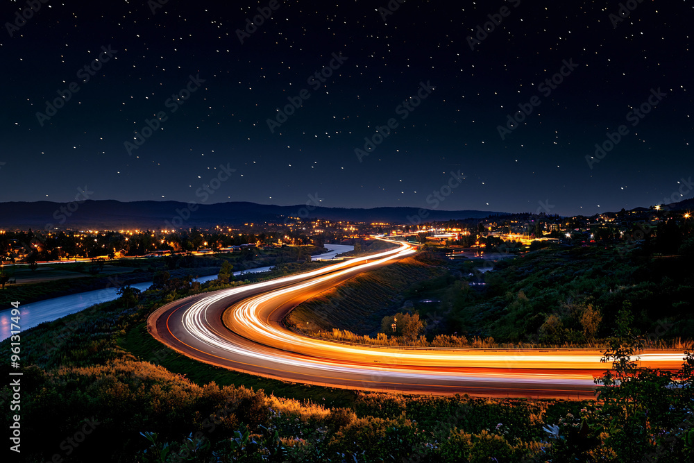 night highway with flowing light trails of vehicles under a starry sky, curving through a hilly and green landscape night highway with flowing light trails of vehicles under a starry sky, curving through a hilly and green landscape