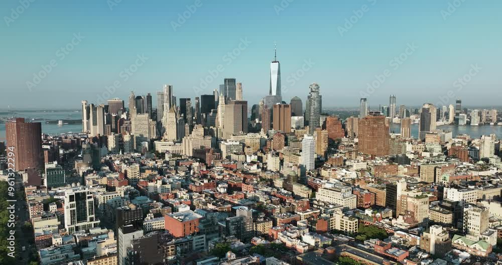 Flying backwards above New York buildings with Lower Manhattan city skyline, clear sunny day, business concept Flying backwards above New York buildings with Lower Manhattan city skyline, clear sunny day, business concept