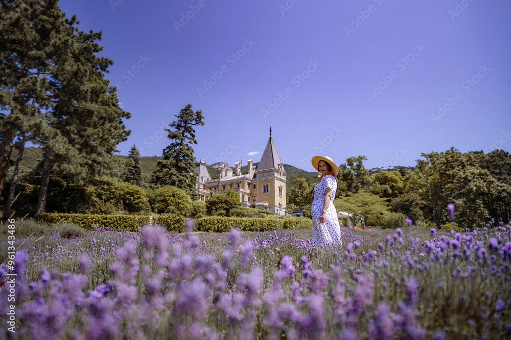 Ταπετσαρία A woman is walking through a field of purple flowers