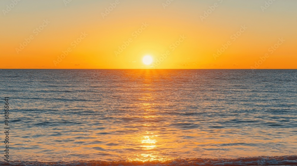 Fototapeta premium Golden Sunset Over Calm Ocean Waters