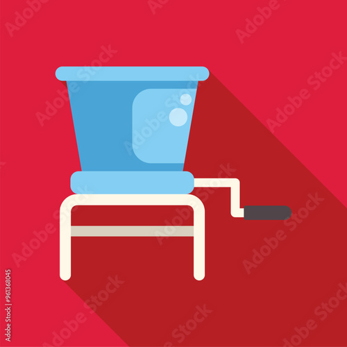Mechanical food grinder standing on red background with long shadow, kitchen appliance for meat processing