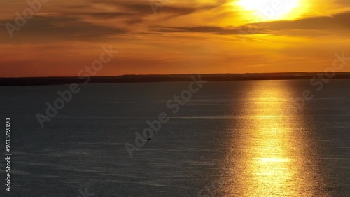 Boat sails on the sea at sunset. a yacht sails on the bay in the sea at sunset, hel peninsula hel Poland.
Sailing on the sea at sunset aerial drone video. photo