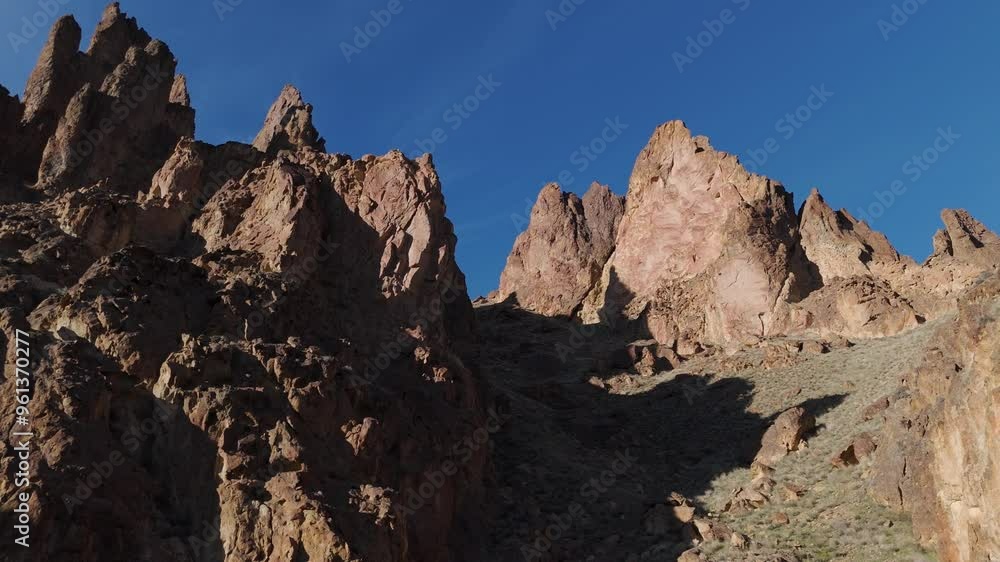 Drone slow climb between rock formations at Leslie Gulch Oregon at sunset Drone slow climb between rock formations at Leslie Gulch Oregon at sunset