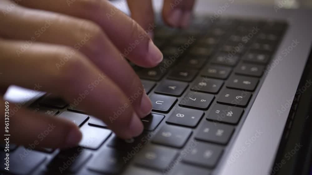 Female professional working from home, typing quickly on her laptop, focused on the screen while handling digital documents and applications, representing productivity in a remote work environment Female professional working from home, typing quickly on her laptop, focused on the screen while handling digital documents and applications, representing productivity in a remote work environment