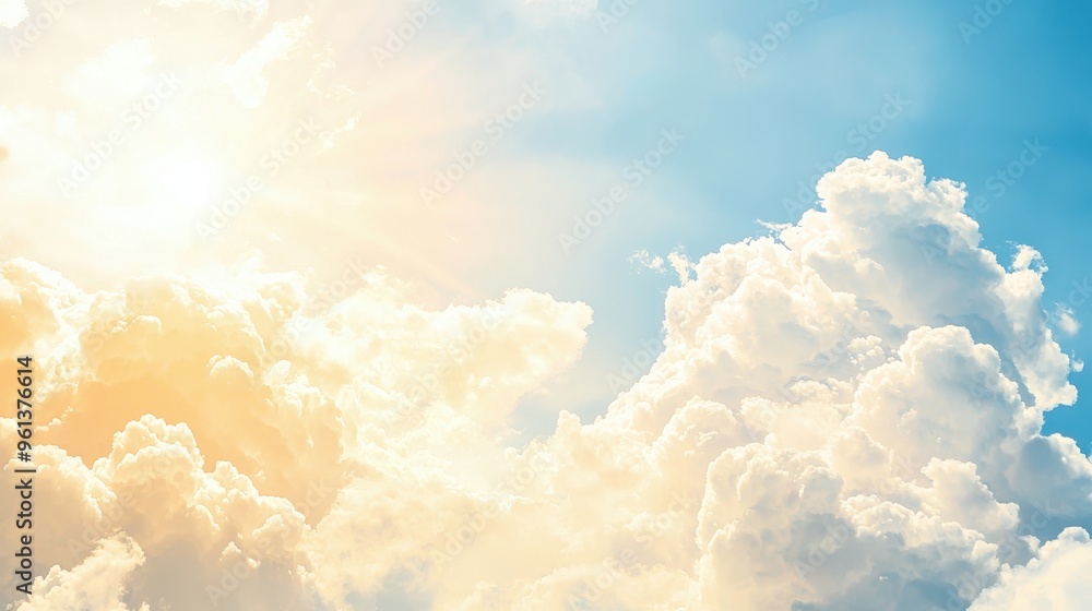 Beautiful White Fluffy Clouds in a Blue Sky with Sunlight Beautiful White Fluffy Clouds in a Blue Sky with Sunlight