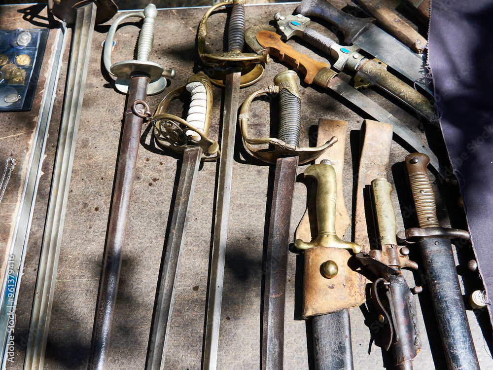 Old antique sabers, knives, daggers and bayonets at flea market Old antique sabers, knives, daggers and bayonets at flea market