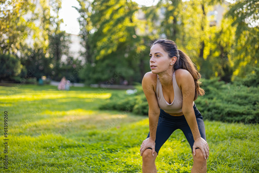 Fit Woman Taking a Break During Outdoor Workout in Park Fit Woman Taking a Break During Outdoor Workout in Park