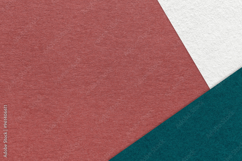 Fototapeta premium Texture craft dark red paper background with white and emerald border. Vintage abstract maroon cardboard.